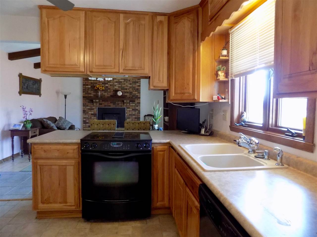 4401 Centerville Road Rockford, IL 61102 - Photo 6 of 23 a kitchen with a sink stove and cabinets