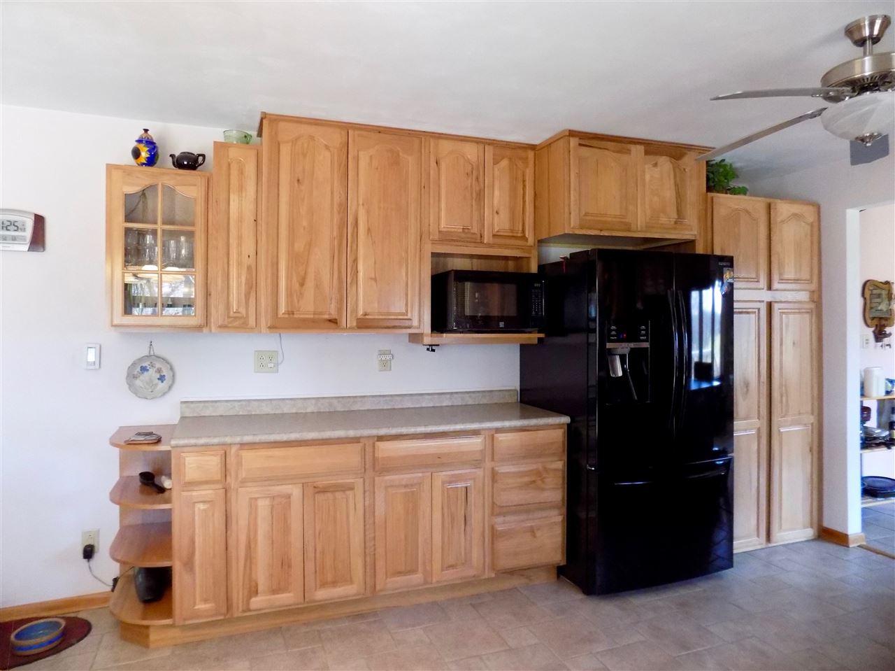 4401 Centerville Road Rockford, IL 61102 - Photo 8 of 23 a kitchen with a refrigerator and cabinets