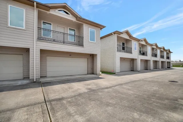 a front view of a house with a garage
