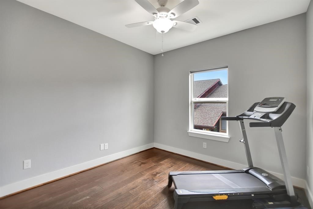 20 Evanston Street Houston, TX 77015 - Photo 13 of 31 a room with wooden floor and white walls