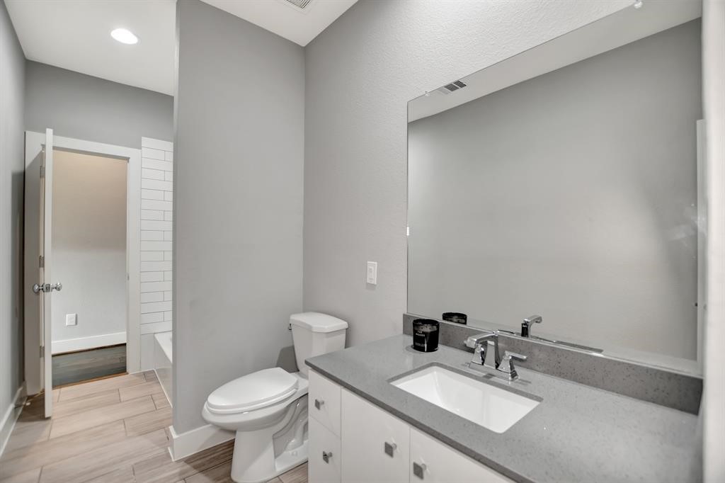 20 Evanston Street Houston, TX 77015 - Photo 15 of 31 a bathroom with a sink toilet and mirror