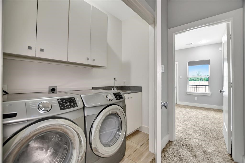 20 Evanston Street Houston, TX 77015 - Photo 17 of 31 a view of storage and utility room with washer and dryer