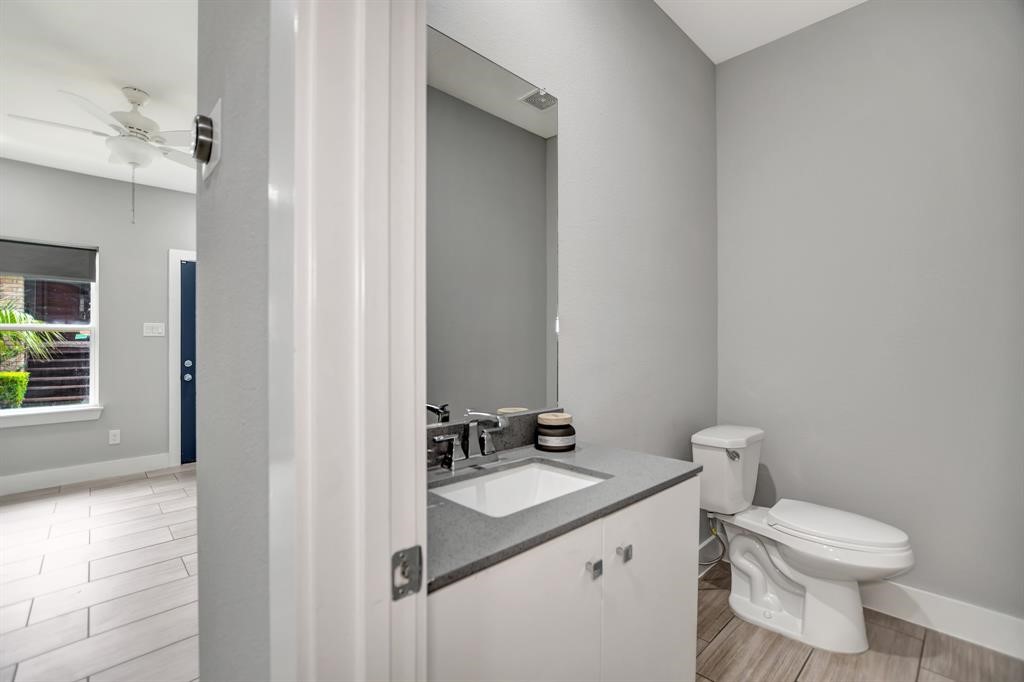 20 Evanston Street Houston, TX 77015 - Photo 9 of 31 a bathroom with a sink a toilet and a mirror