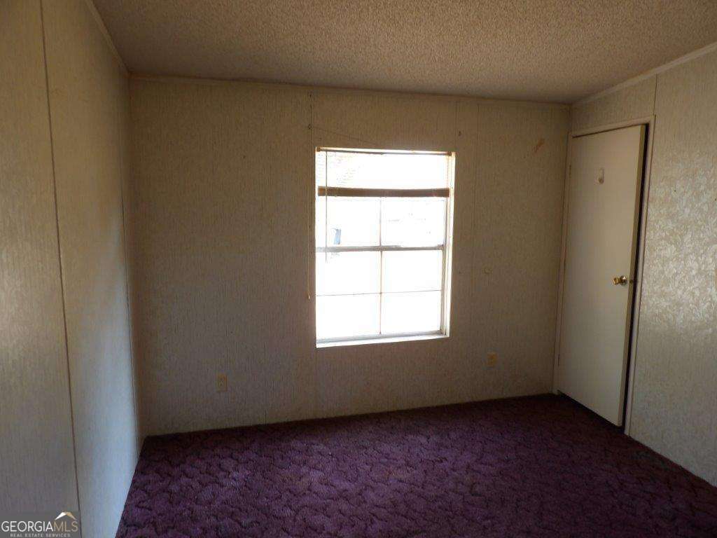 111 Sunnyside Drive Box Springs, GA 31801 - Photo 15 of 18 an empty room with a window