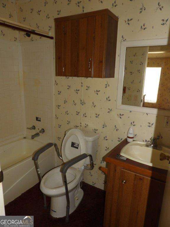 111 Sunnyside Drive Box Springs, GA 31801 - Photo 17 of 18 a bathroom with a sink toilet and shower