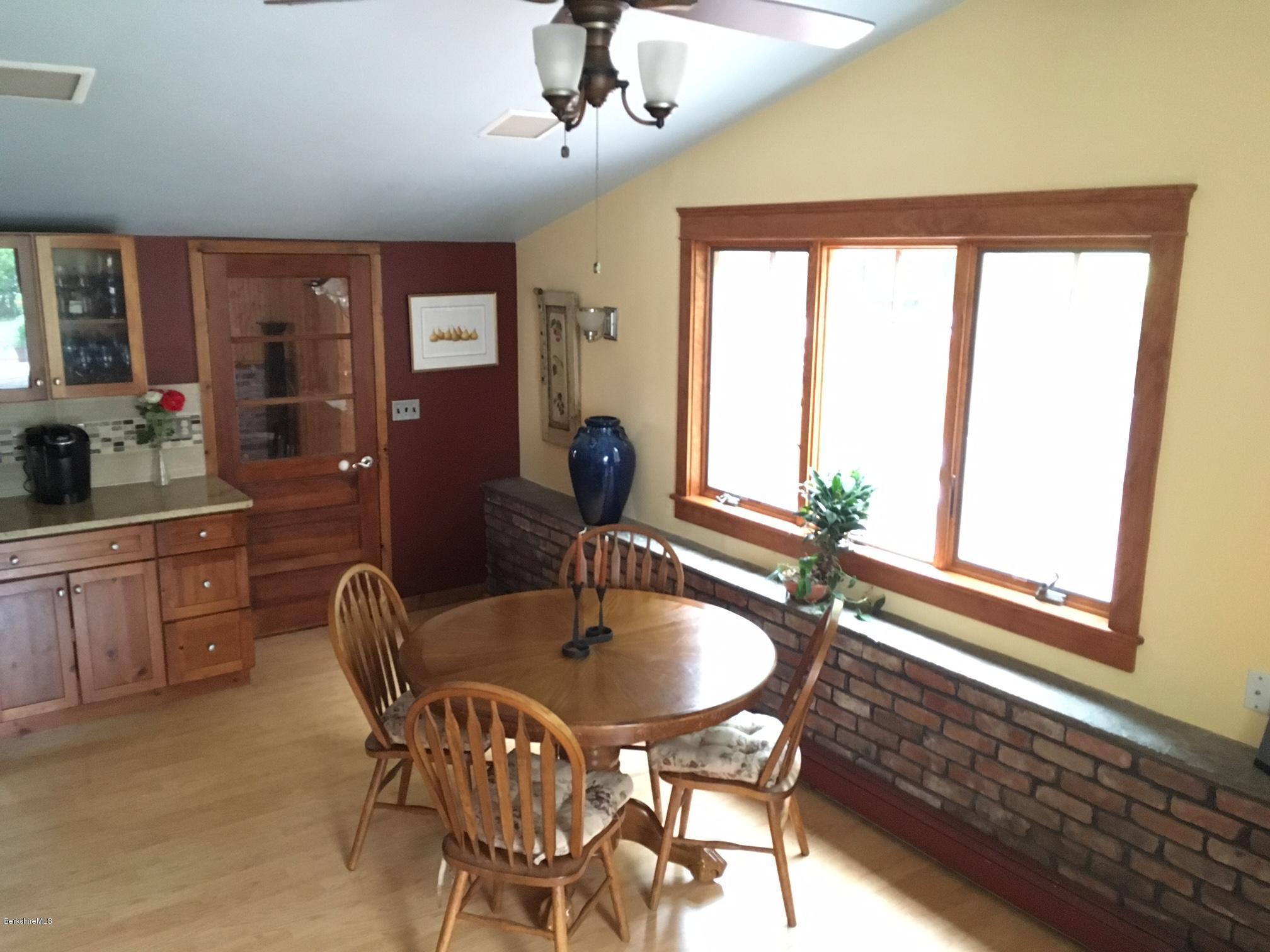 17 Spring Road Adams, MA 01220 - Photo 11 of 37 a dining room with furniture a chandelier and window