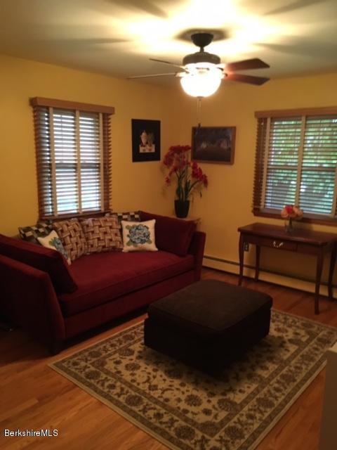 17 Spring Road Adams, MA 01220 - Photo 19 of 37 a living room with furniture and a flat screen tv