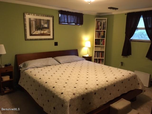 17 Spring Road Adams, MA 01220 - Photo 23 of 37 a bedroom with a bed and painting on the wall