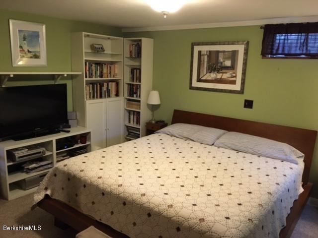 17 Spring Road Adams, MA 01220 - Photo 24 of 37 a bedroom with a bed and a flat screen tv