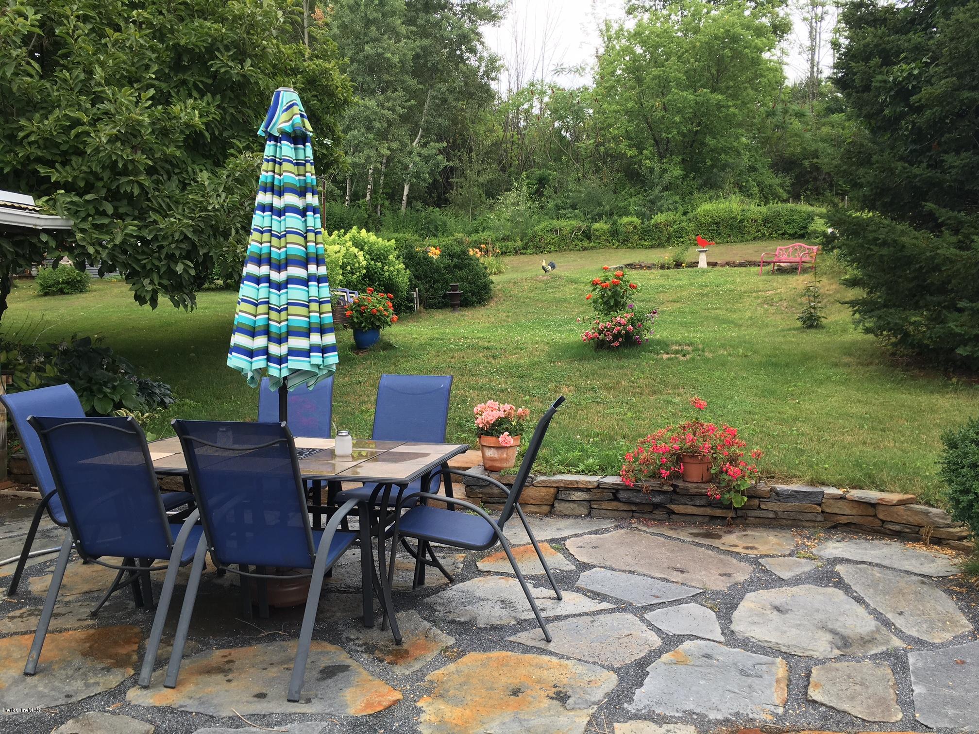 17 Spring Road Adams, MA 01220 - Photo 31 of 37 a view of a table and chairs in the garden