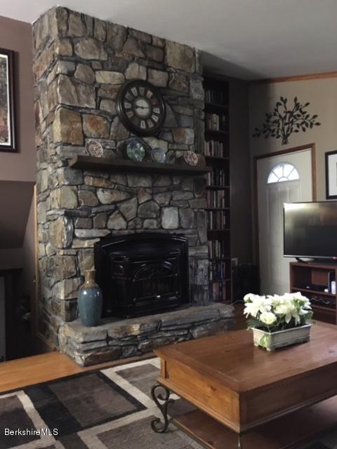 17 Spring Road Adams, MA 01220 - Photo 8 of 37 a living room with furniture and a fireplace