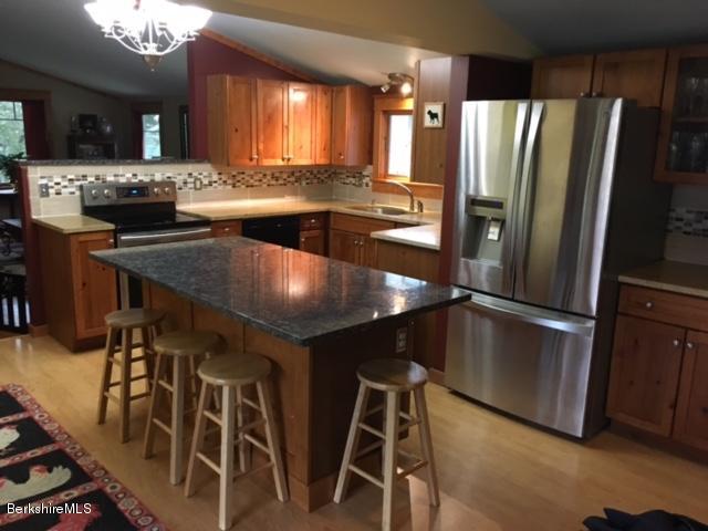 17 Spring Road Adams, MA 01220 - Photo 10 of 37 a kitchen with kitchen island a counter top space appliances and a counter space