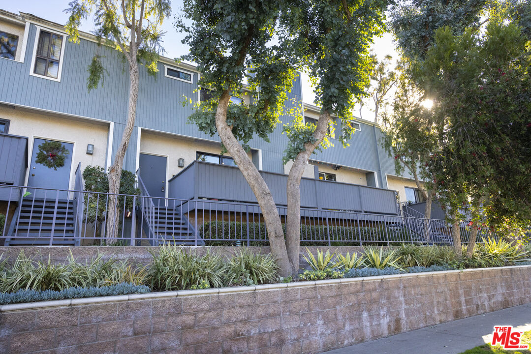 front view of a house with a garden
