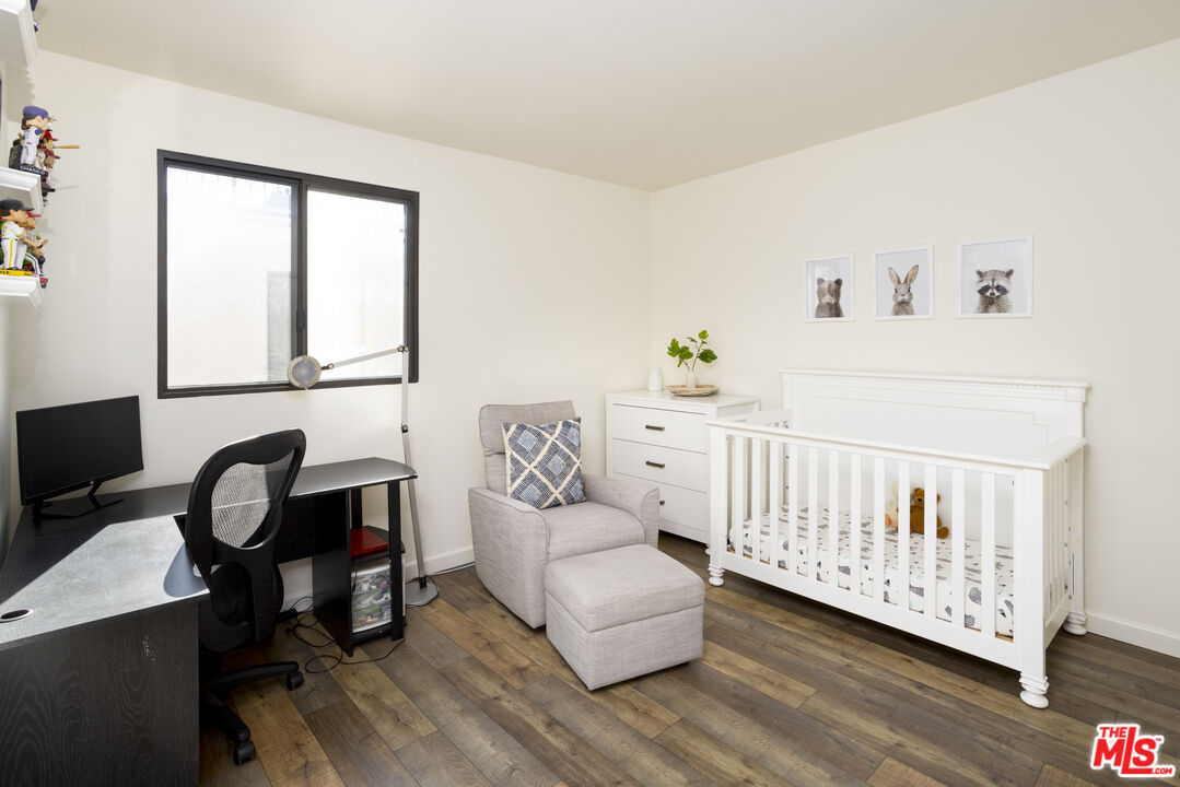 8176 Manitoba Street, Unit 4 Playa del Rey, CA 90293 - Photo 11 of 24 a bedroom with a bed and a window