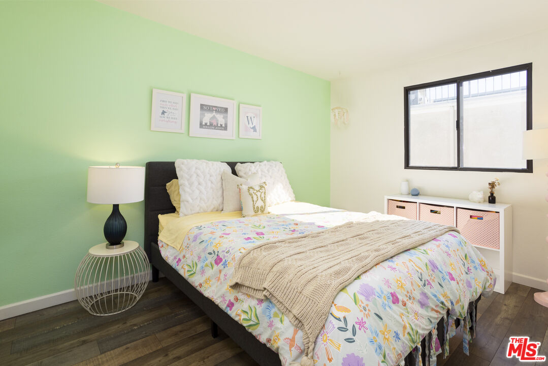 8176 Manitoba Street, Unit 4 Playa del Rey, CA 90293 - Photo 12 of 24 a bedroom with a bed and a window