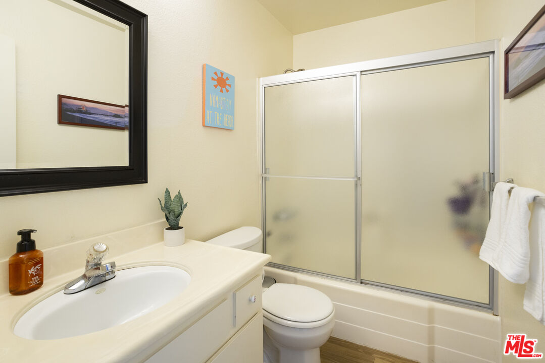 8176 Manitoba Street, Unit 4 Playa del Rey, CA 90293 - Photo 13 of 24 a bathroom with a sink toilet and shower