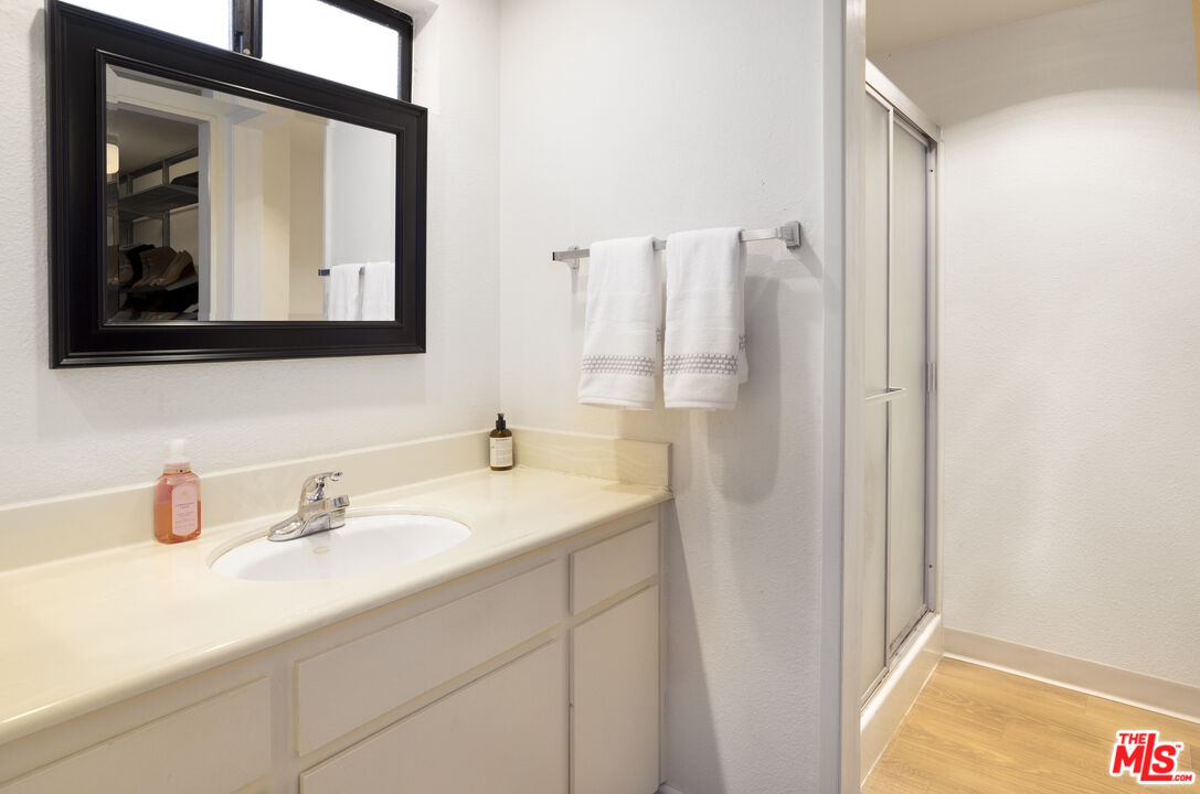 8176 Manitoba Street, Unit 4 Playa del Rey, CA 90293 - Photo 10 of 24 a bathroom with a sink and a mirror