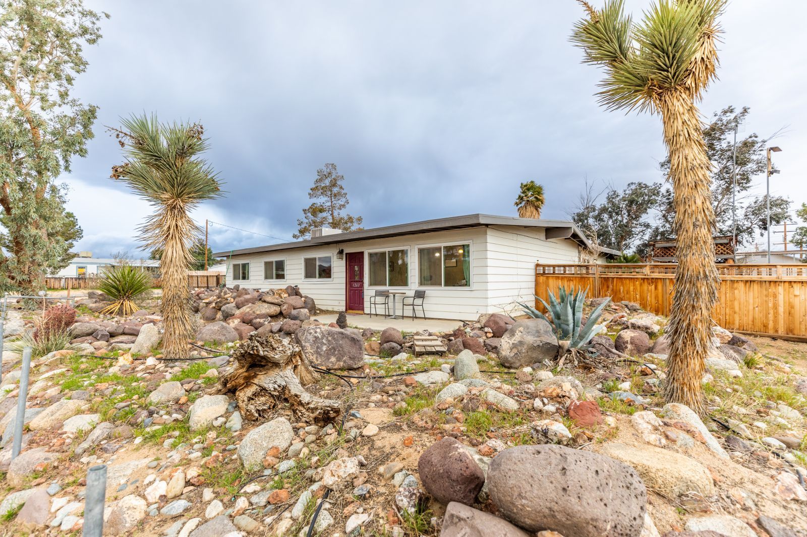 1263 South Primrose Street Ridgecrest, CA 93555 - Photo 3 of 36 a view of a yard with a house