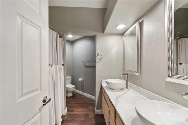 an aerial view of multiple houses with yard