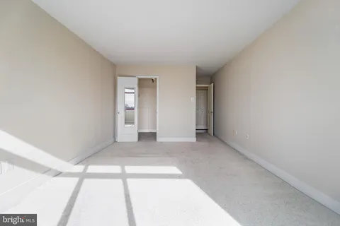 a view of an empty room and window