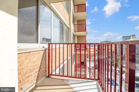 a living room with lots of furniture and a chandelier