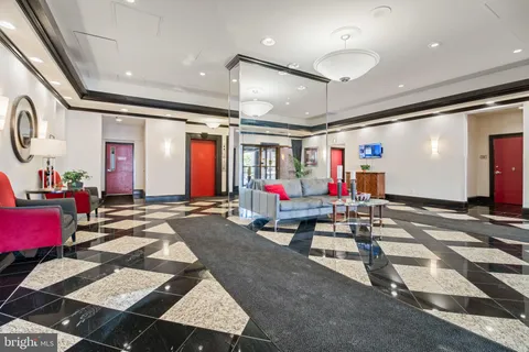 a living room with furniture and a rug