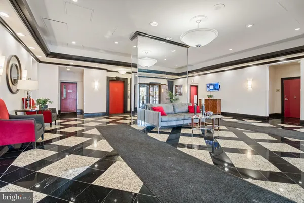 a living room with furniture and a rug