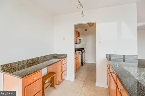 a kitchen with stainless steel appliances granite countertop a sink and dishwasher