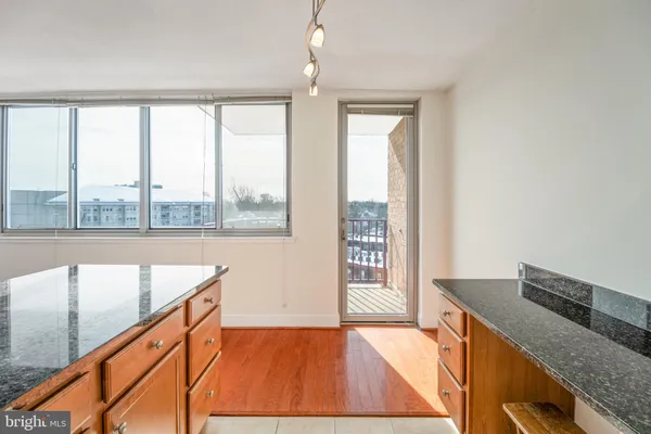a kitchen with a large window