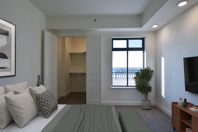 a bedroom with furniture and a window