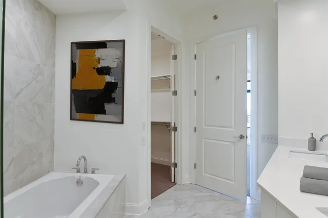 a bathroom with a tub and a sink