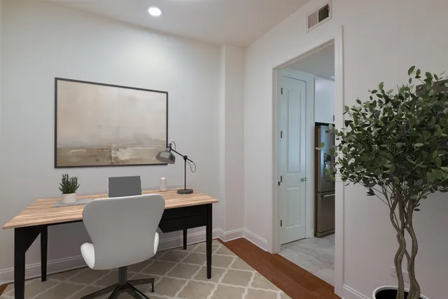 a dining room with furniture and wooden floor