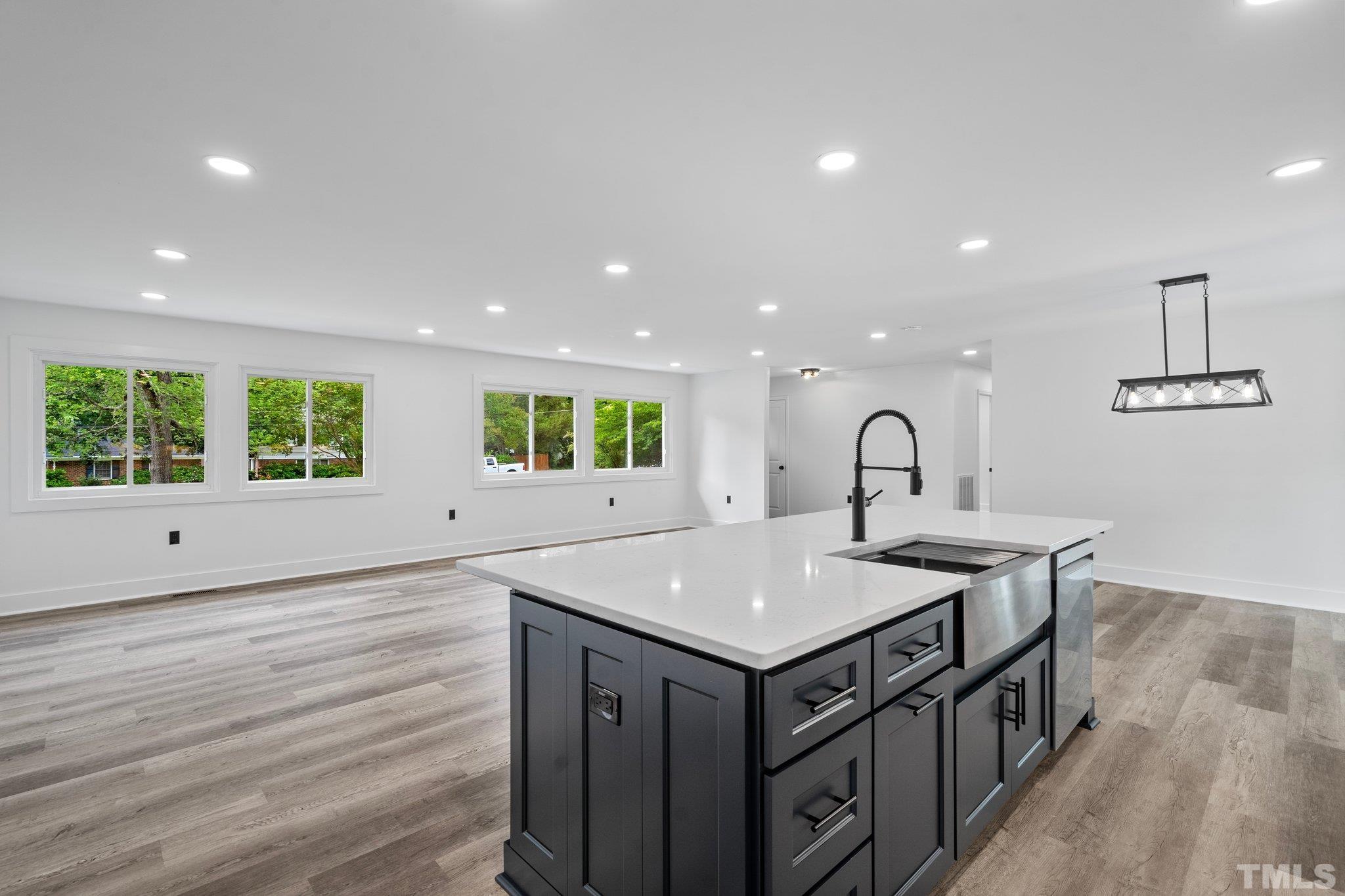 1102 Jerome Road Durham, NC 27713 - Photo 12 of 41 a view of a kitchen counter space a sink and wooden floor