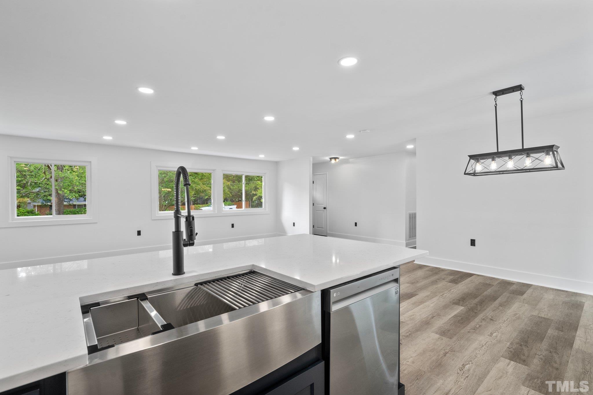 1102 Jerome Road Durham, NC 27713 - Photo 15 of 41 a view of kitchen with center island and living room