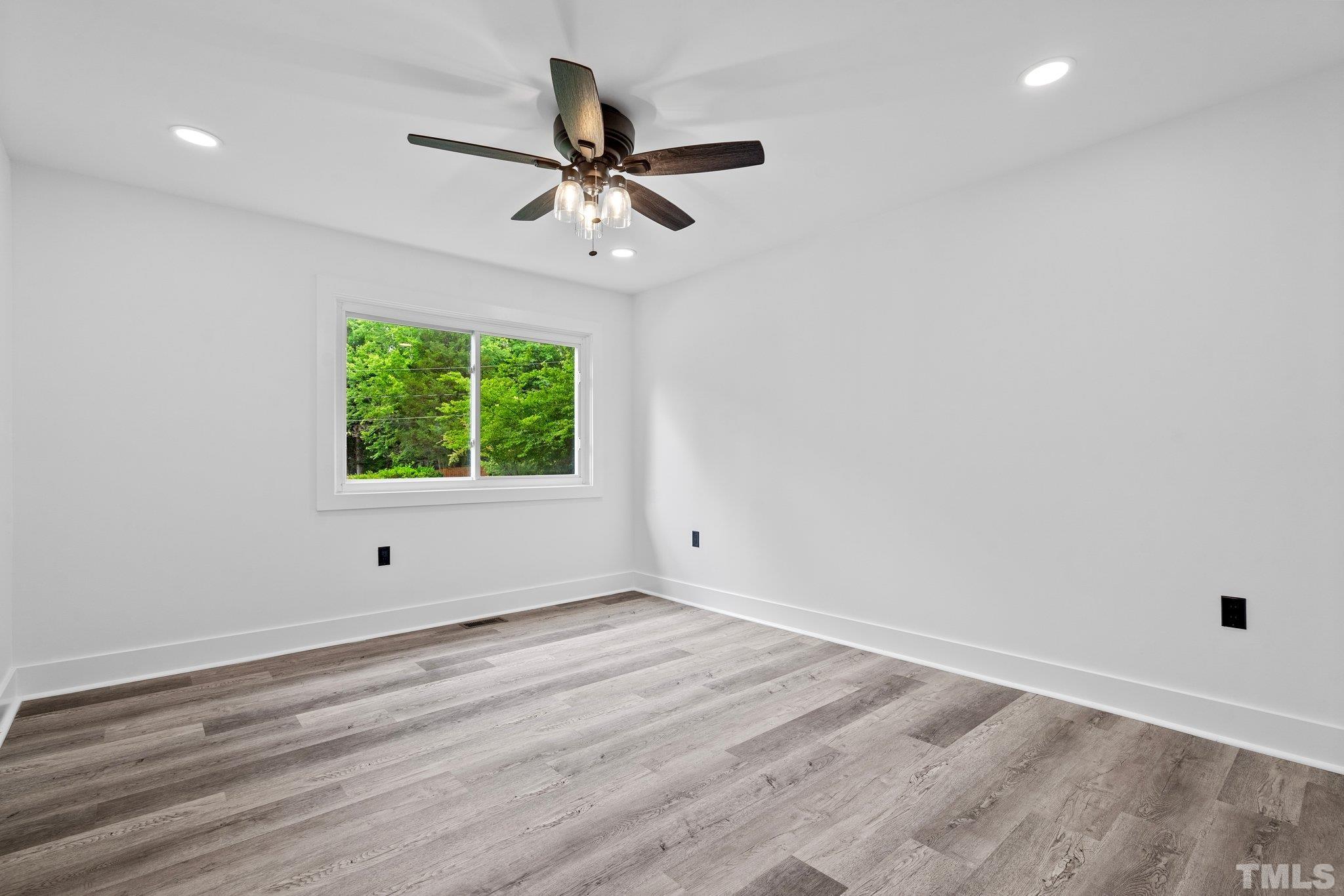 1102 Jerome Road Durham, NC 27713 - Photo 18 of 41 a view of a room with a window and a ceiling fan