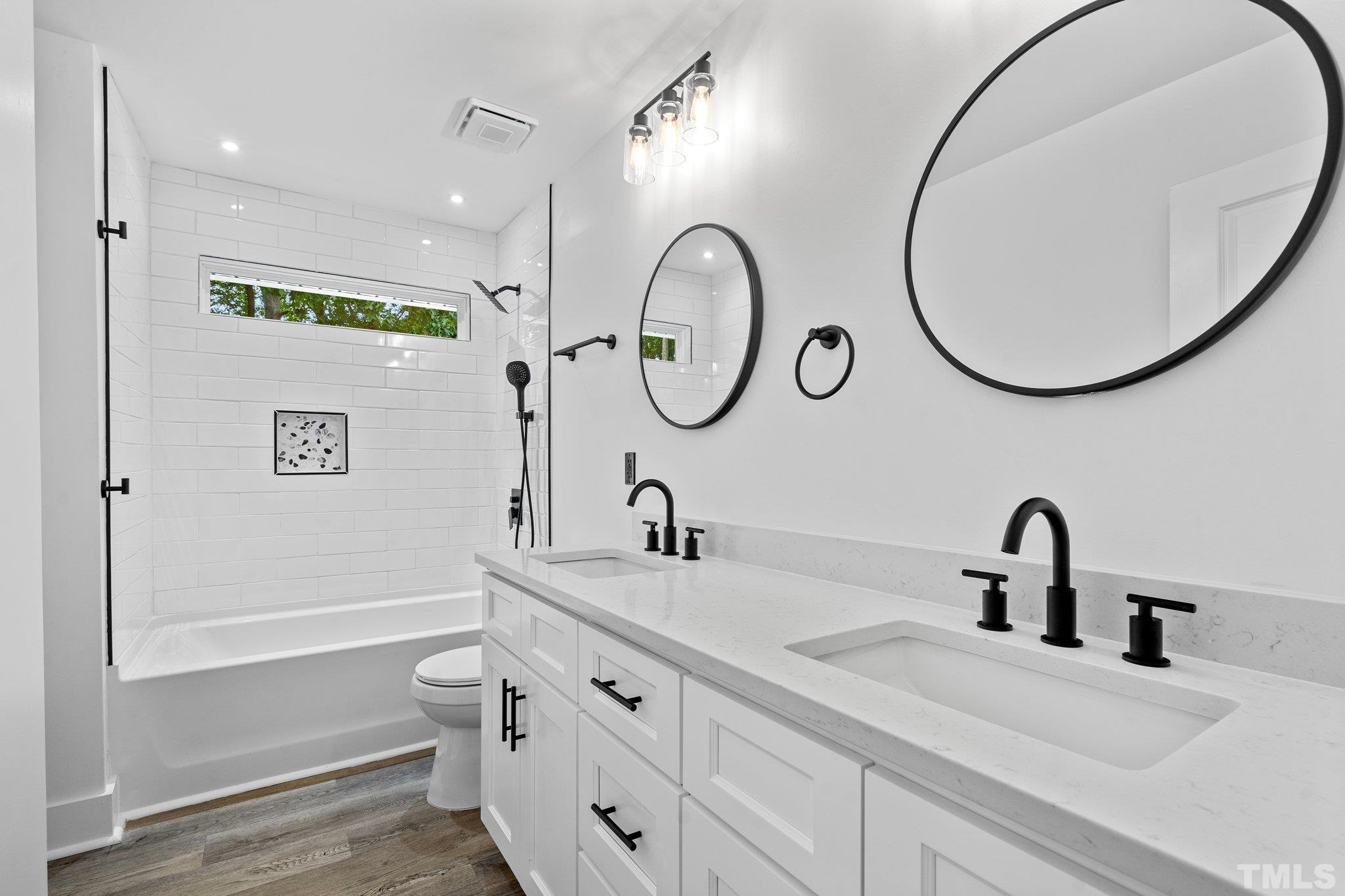 1102 Jerome Road Durham, NC 27713 - Photo 22 of 41 a bathroom with a sink and a mirror