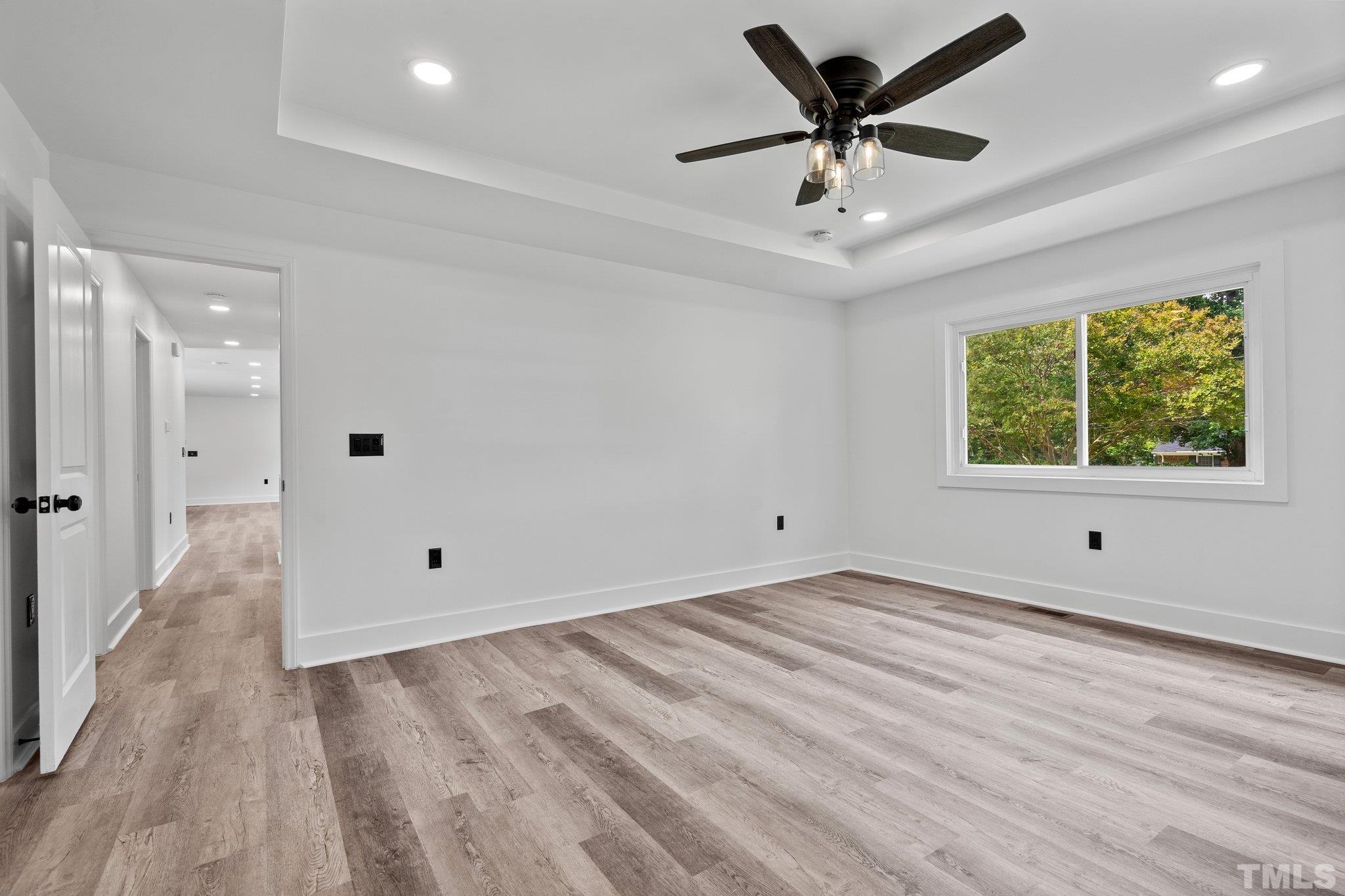 1102 Jerome Road Durham, NC 27713 - Photo 26 of 41 a view of an empty room with a window and a ceiling fan