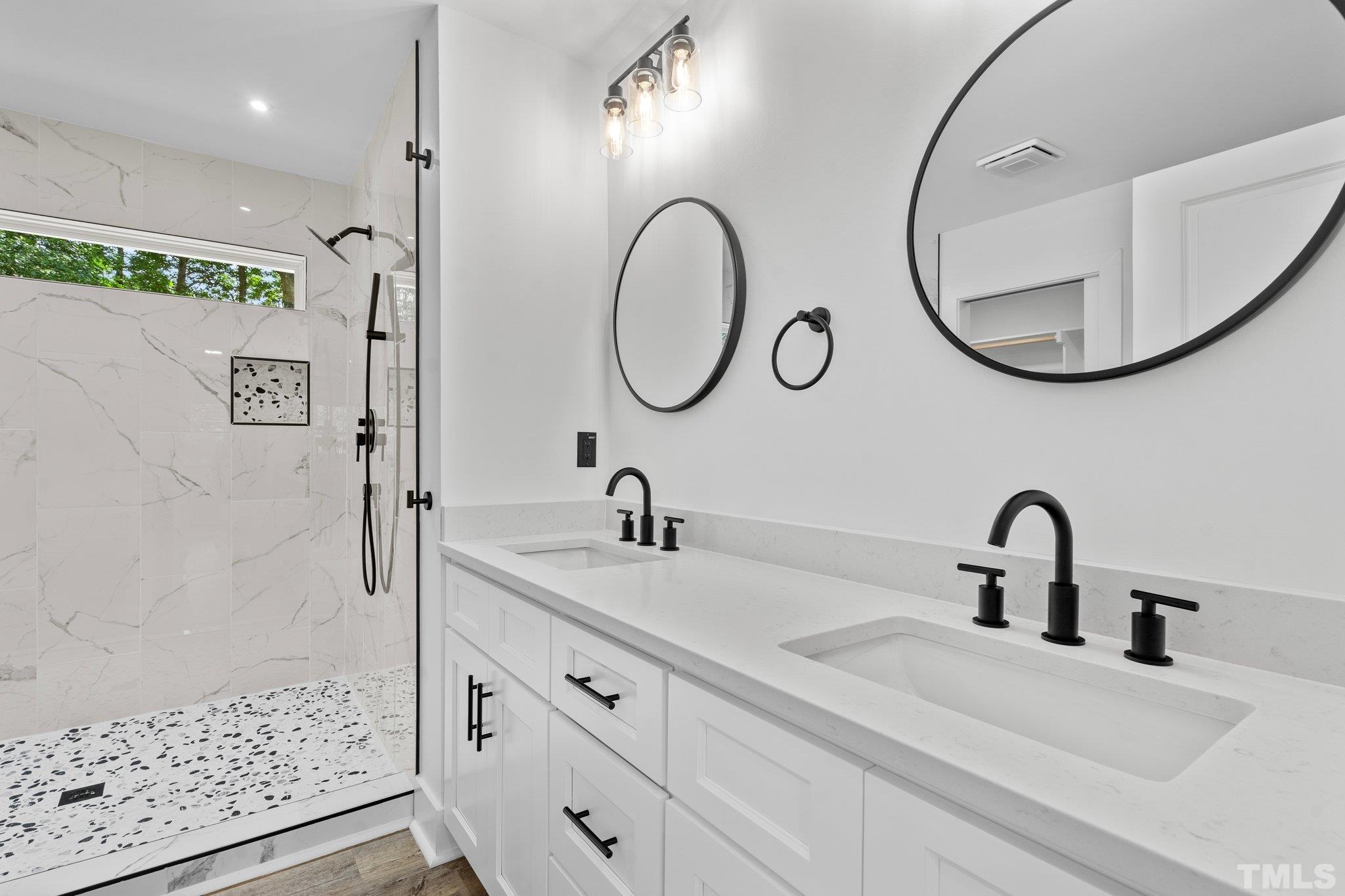 1102 Jerome Road Durham, NC 27713 - Photo 27 of 41 a bathroom with a sink and a mirror