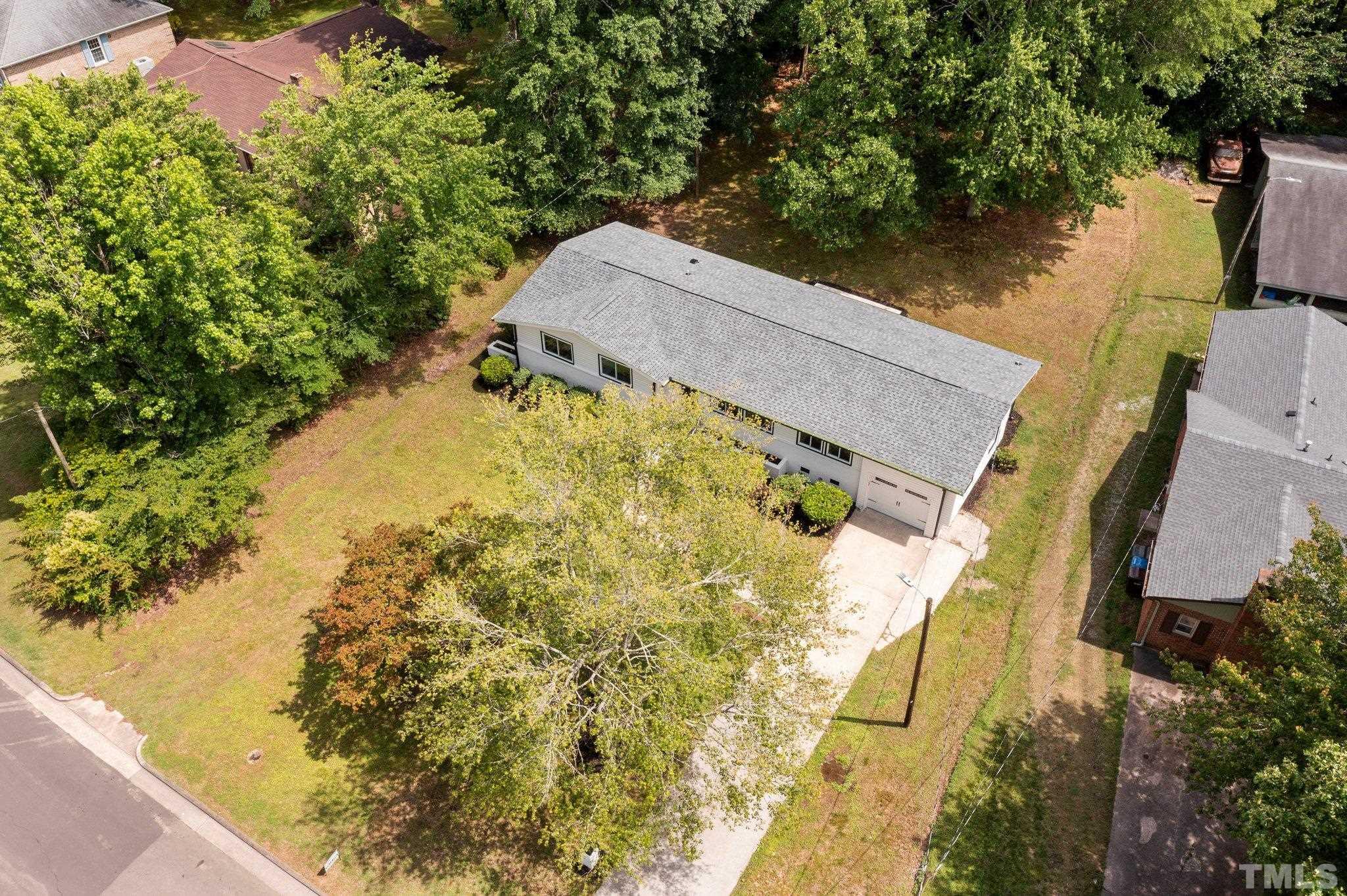 1102 Jerome Road Durham, NC 27713 - Photo 34 of 41 an aerial view of a house with pool plants and large trees