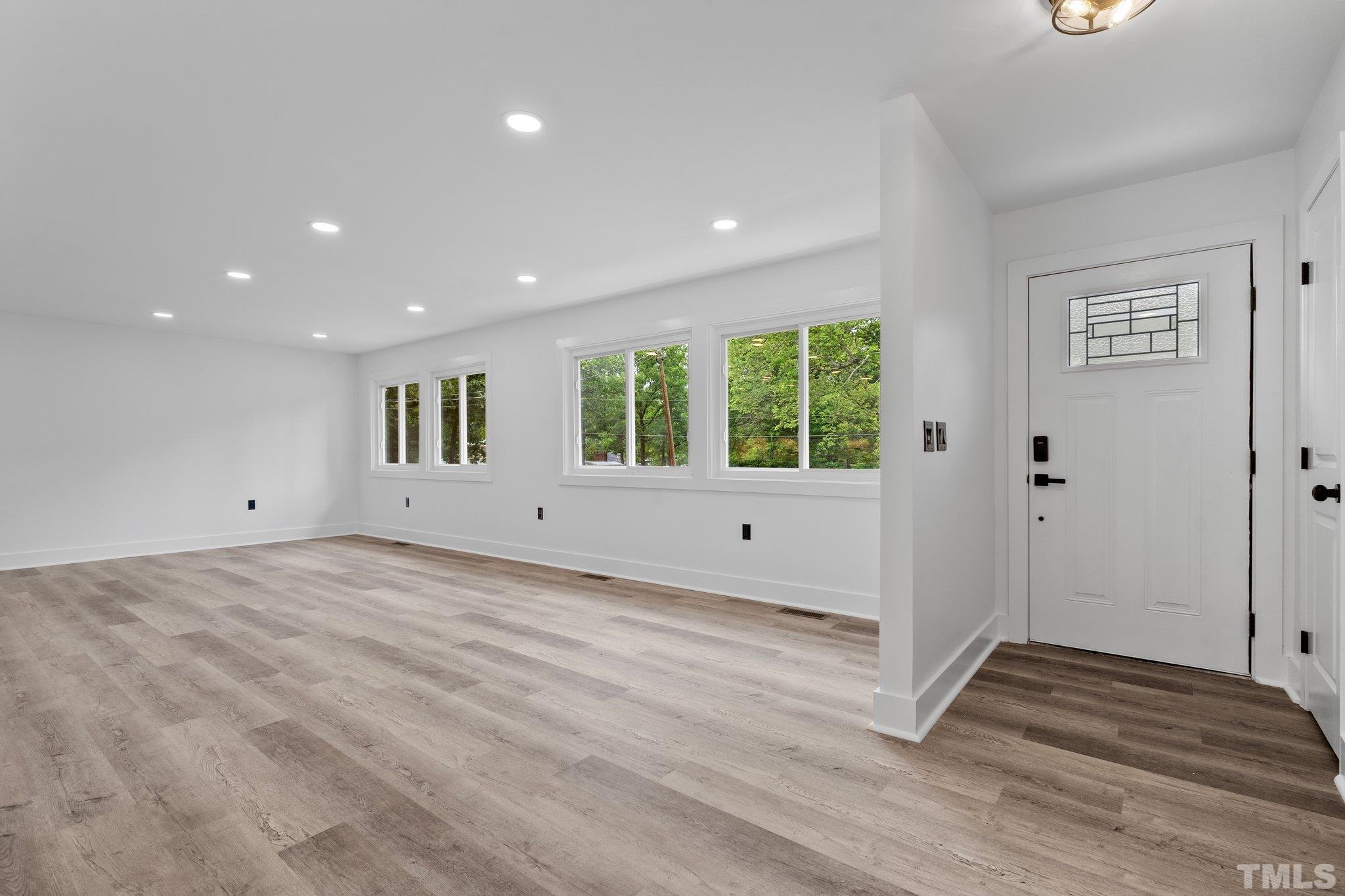 1102 Jerome Road Durham, NC 27713 - Photo 5 of 41 a view of a room with wooden floor and window