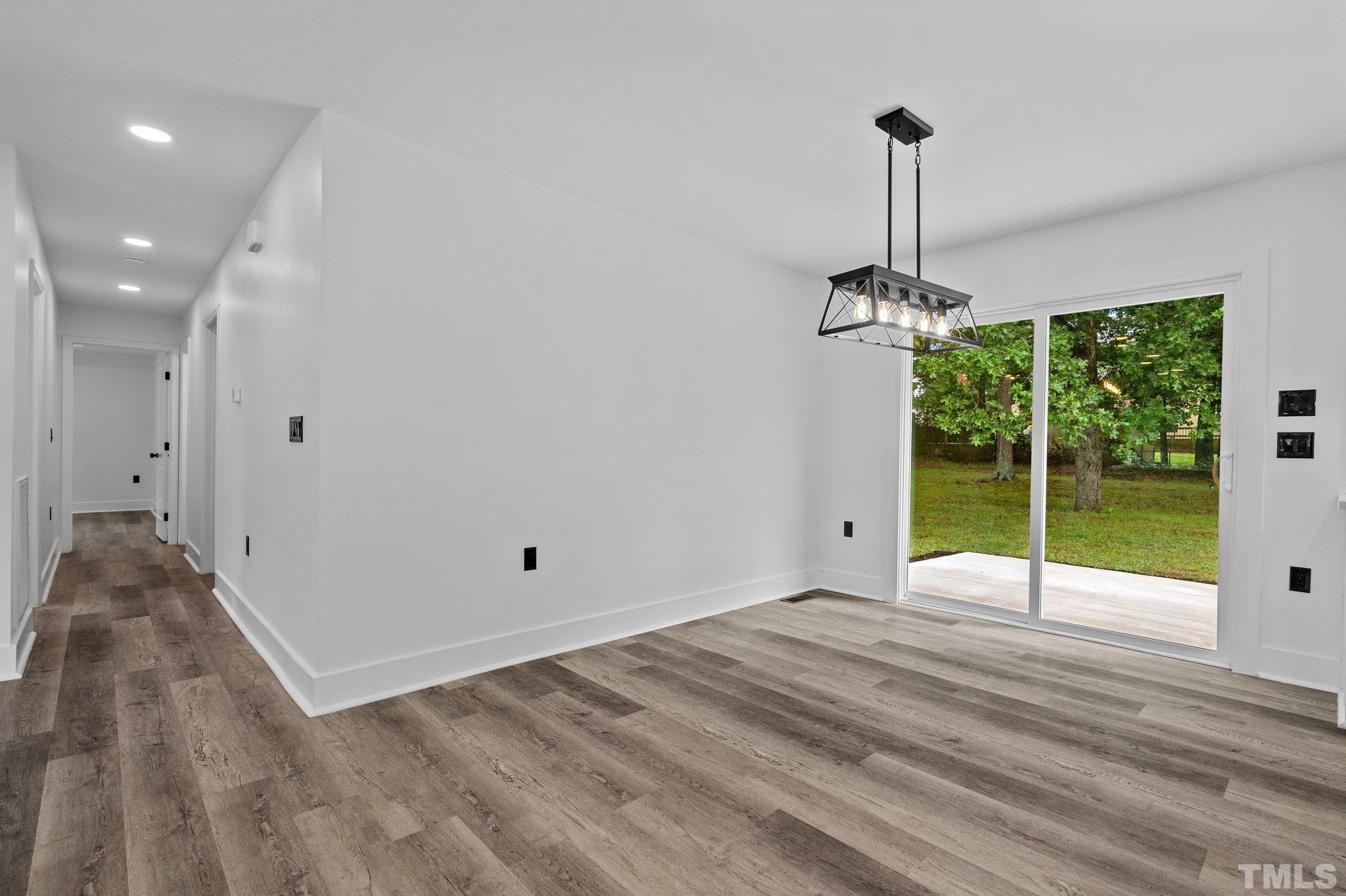 1102 Jerome Road Durham, NC 27713 - Photo 8 of 41 a view of an empty room with windows