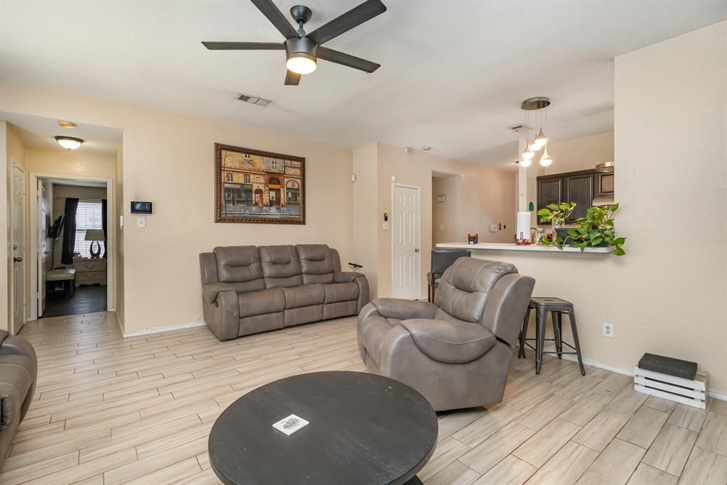 13444 Vida Lane Dallas, TX 75253 - Photo 5 of 17 a living room with furniture and a wooden floor