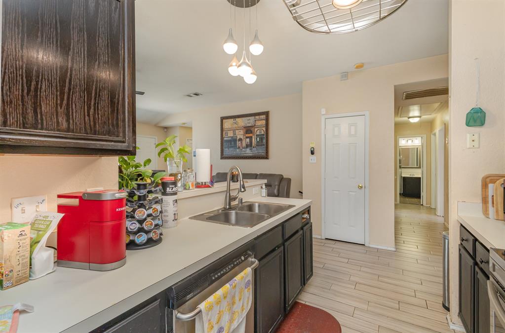 13444 Vida Lane Dallas, TX 75253 - Photo 10 of 17 a kitchen with a sink and cabinets