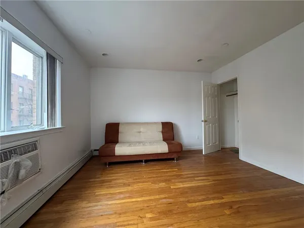 a bedroom with furniture and window
