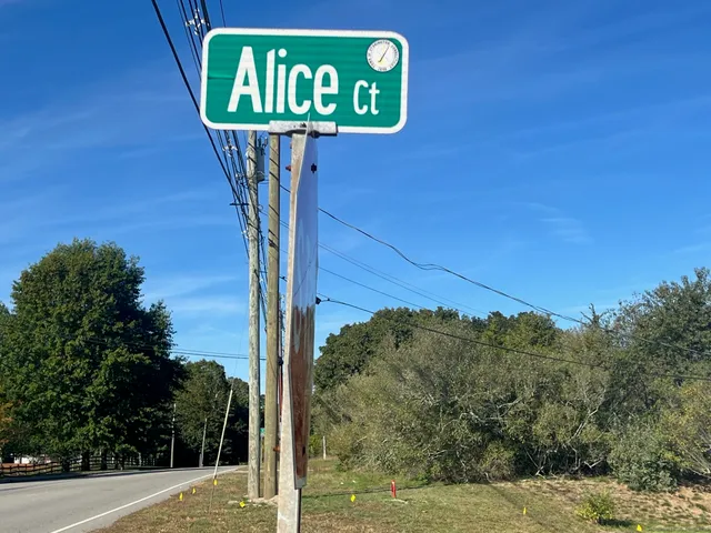 a view of a street with a building in the background