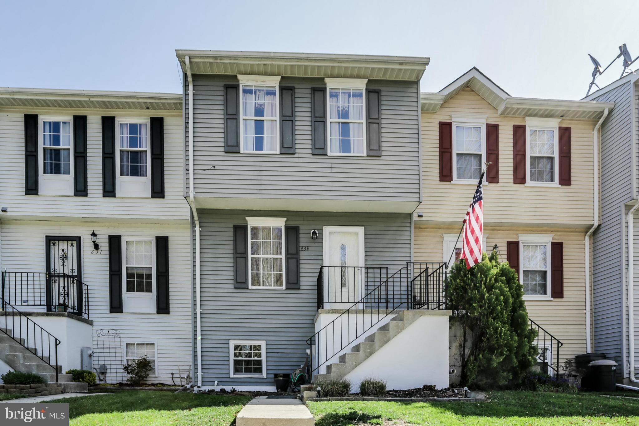 639 Nollmeyer Road Baltimore, MD 21220 - Photo 1 of 28 a front view of a house with a yard and garage