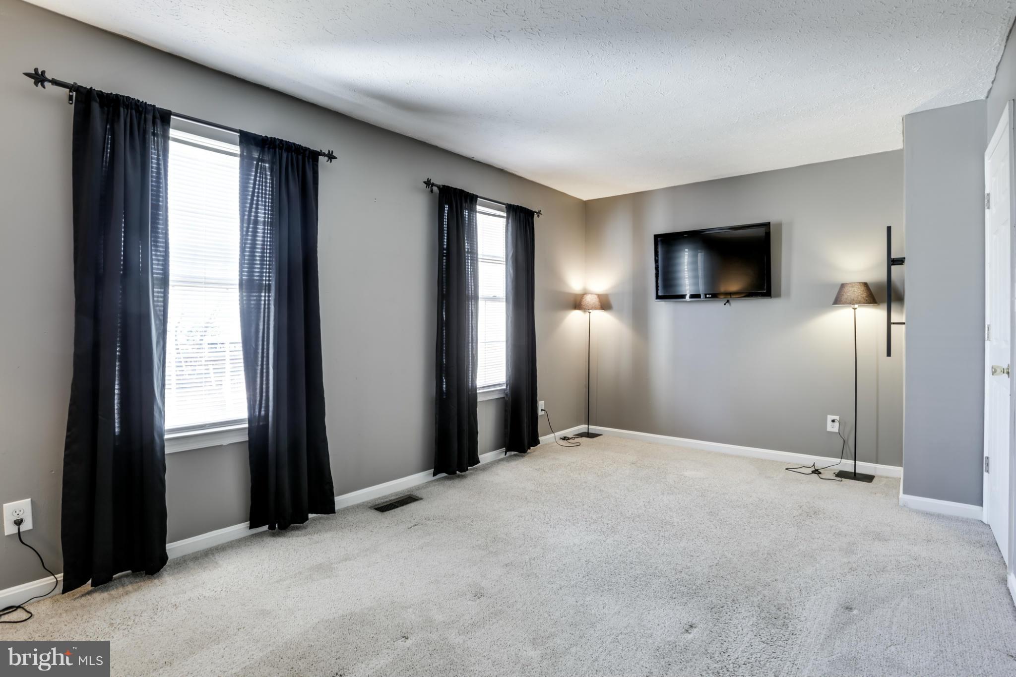 639 Nollmeyer Road Baltimore, MD 21220 - Photo 15 of 28 a view of a livingroom with a flat screen tv