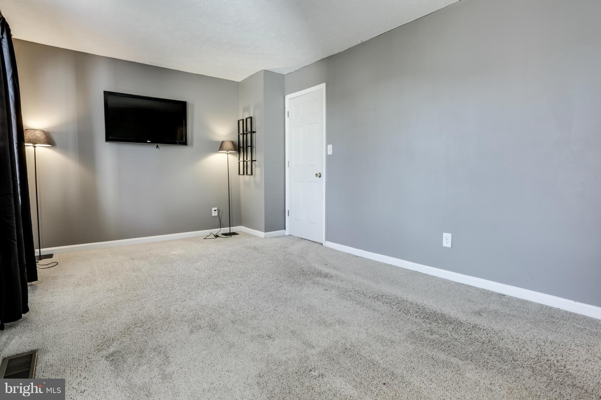 639 Nollmeyer Road Baltimore, MD 21220 - Photo 16 of 28 a view of a livingroom with a flat screen tv