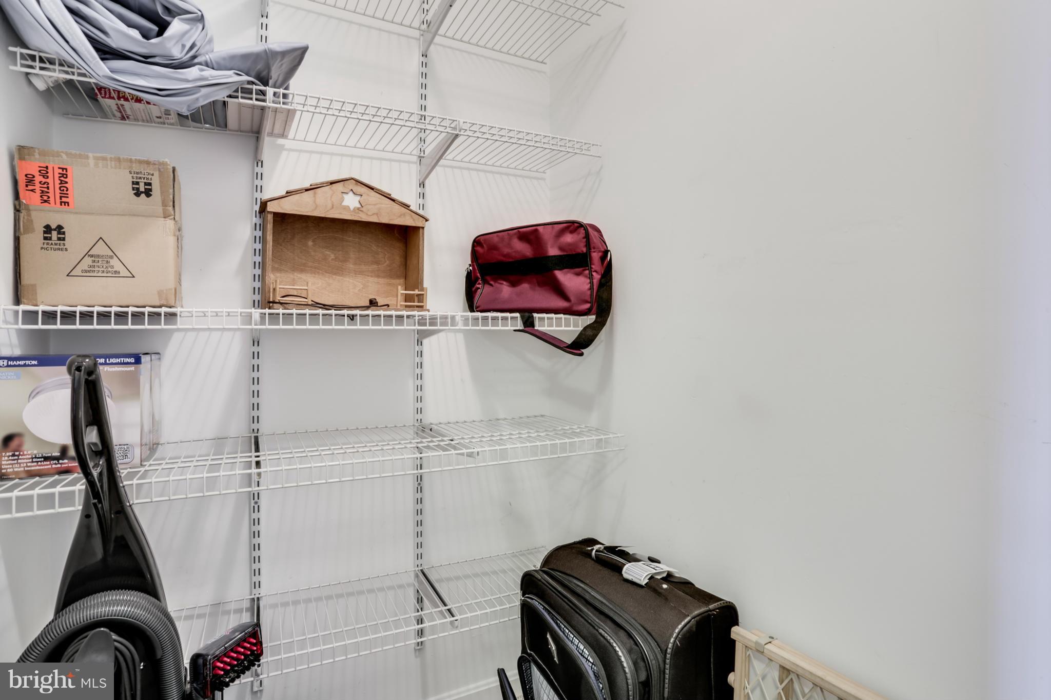 639 Nollmeyer Road Baltimore, MD 21220 - Photo 24 of 28 a view of storage and utility room with racks on the wall