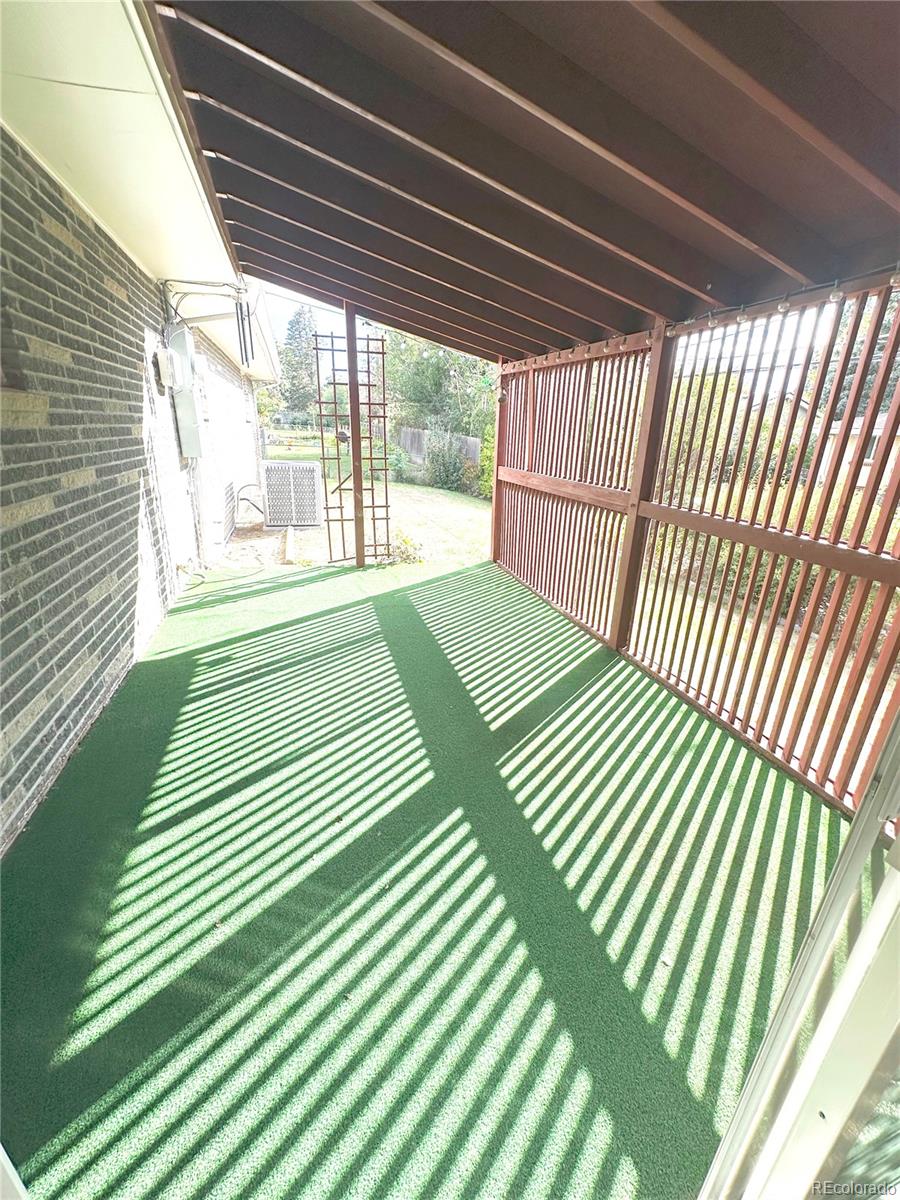 423 Empire Street Aurora, CO 80010 - Photo 14 of 44 a view of a balcony with wooden floor